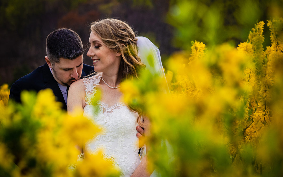 Wedding day timeline: Outdoor bride and groom portrait with yellow flowers at Springfield Manor in Maryland by DC wedding photographer Potok's World Photography