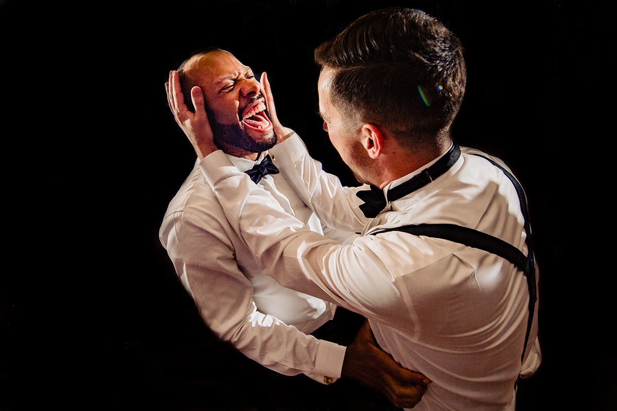 Documentary wedding photography of moment two grooms dancing during wedding reception at Algonkian Golf Course in Virginia by Washington DC wedding photographer Anji Martin of Potok’s World Photography