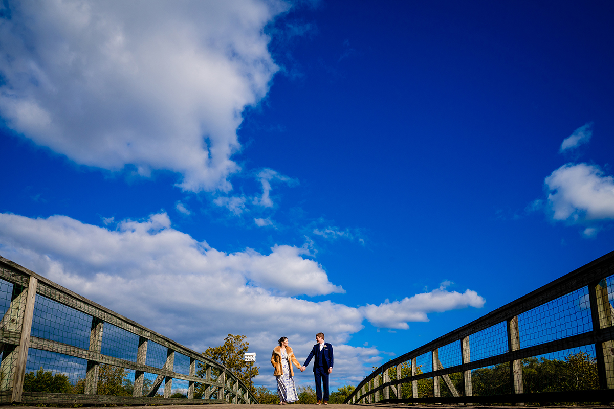 Kingman and Heritage Island post pop-up outdoor wedding ceremony bride and groom portraits with their dog by DC wedding photographers of Potok's World Photography