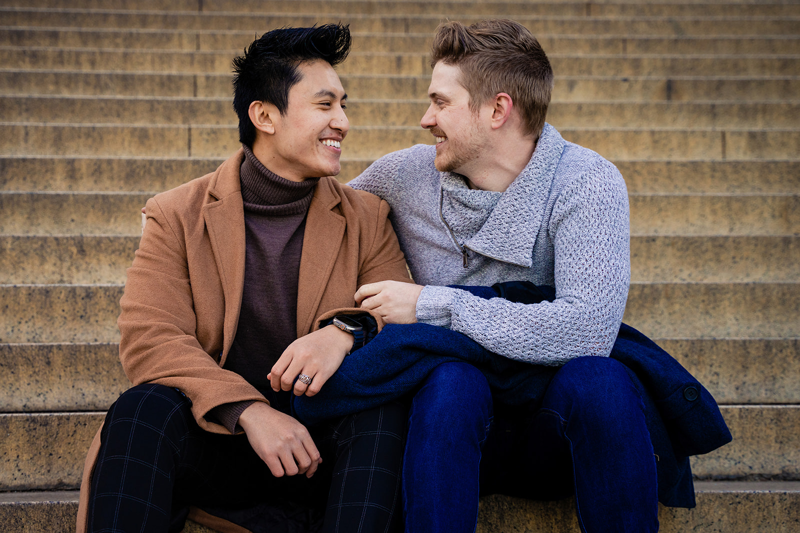 Same sex couple proposing at the Lincoln Memorial with the Reflecting Pool and the Washington Monument in the background by Potok's Word Photography