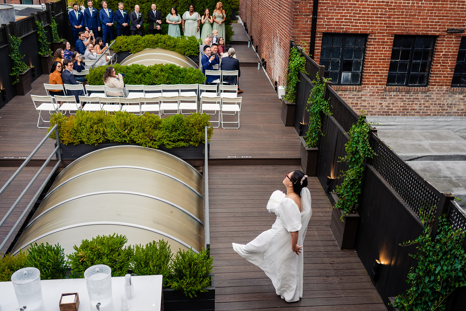 Bride entering her wedding ceremony on the roof top at Fathom Gallery 14th Street in DC